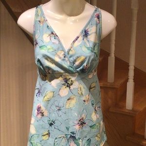 Slip on blue floral silky knit baby doll top NWOT